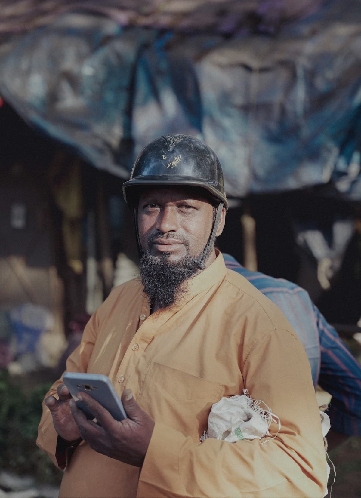 Construction professional using a mobile device on site