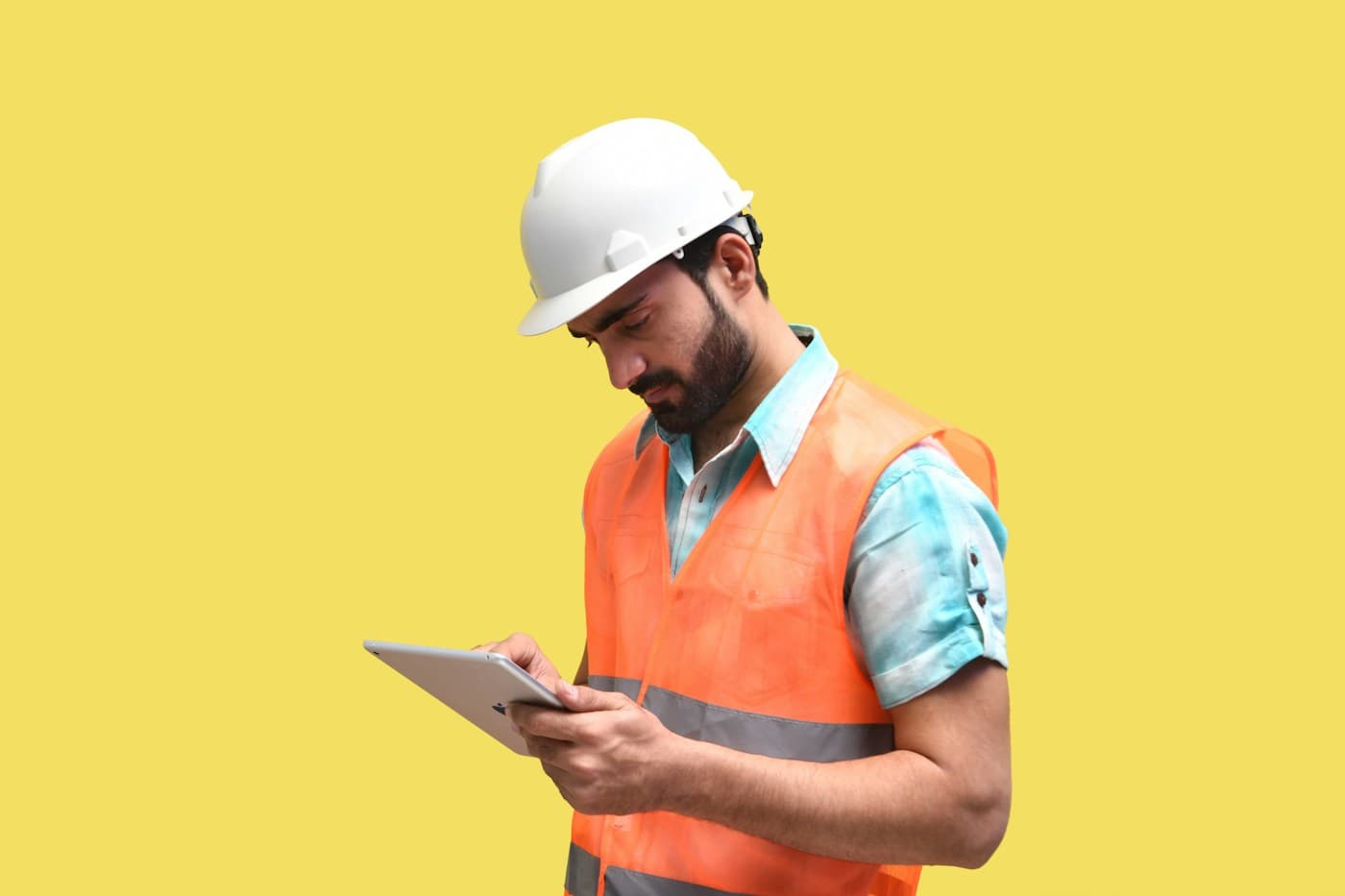 Field worker reviewing construction updates on a tablet