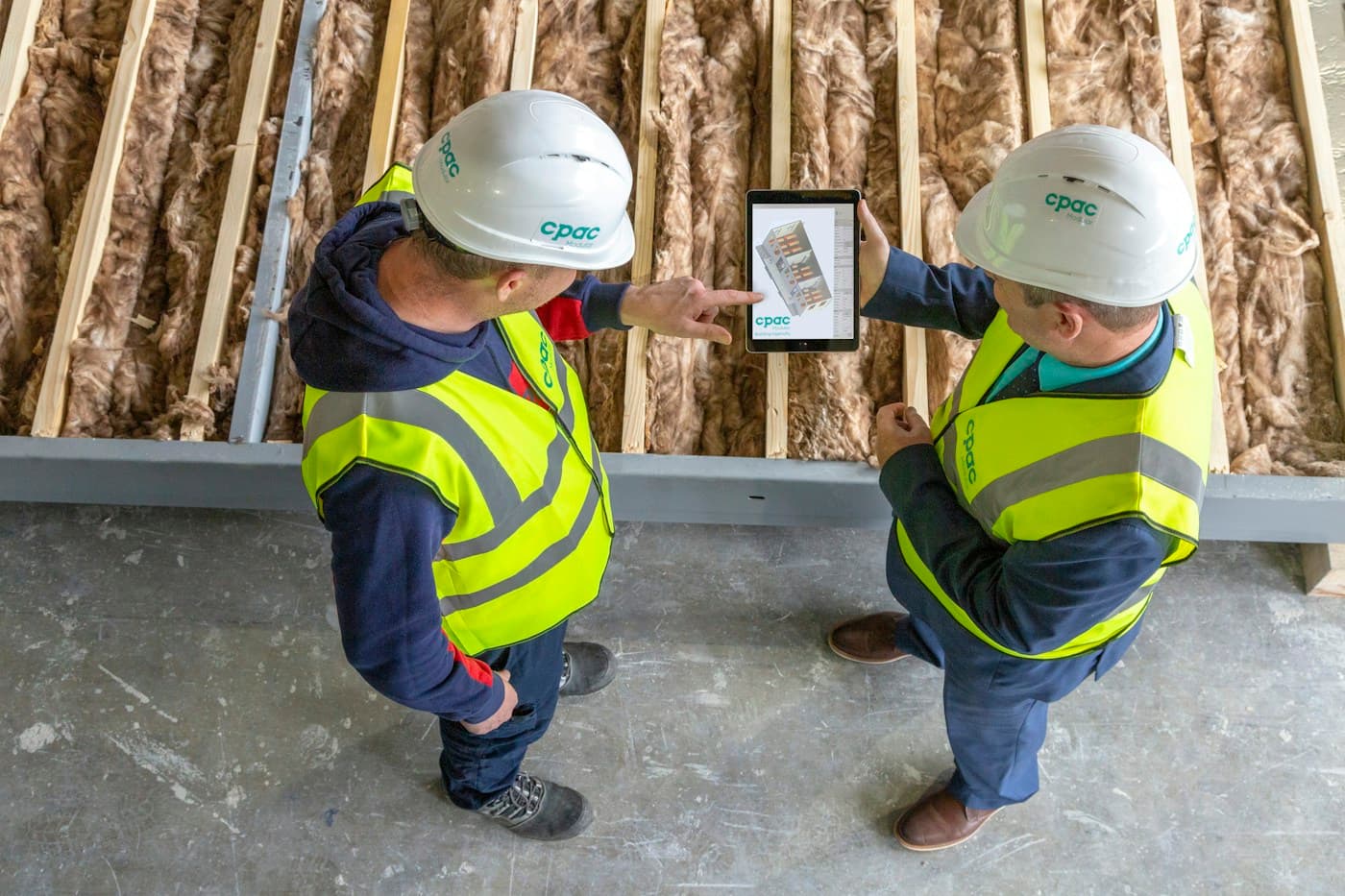 Construction workers reviewing project progress together